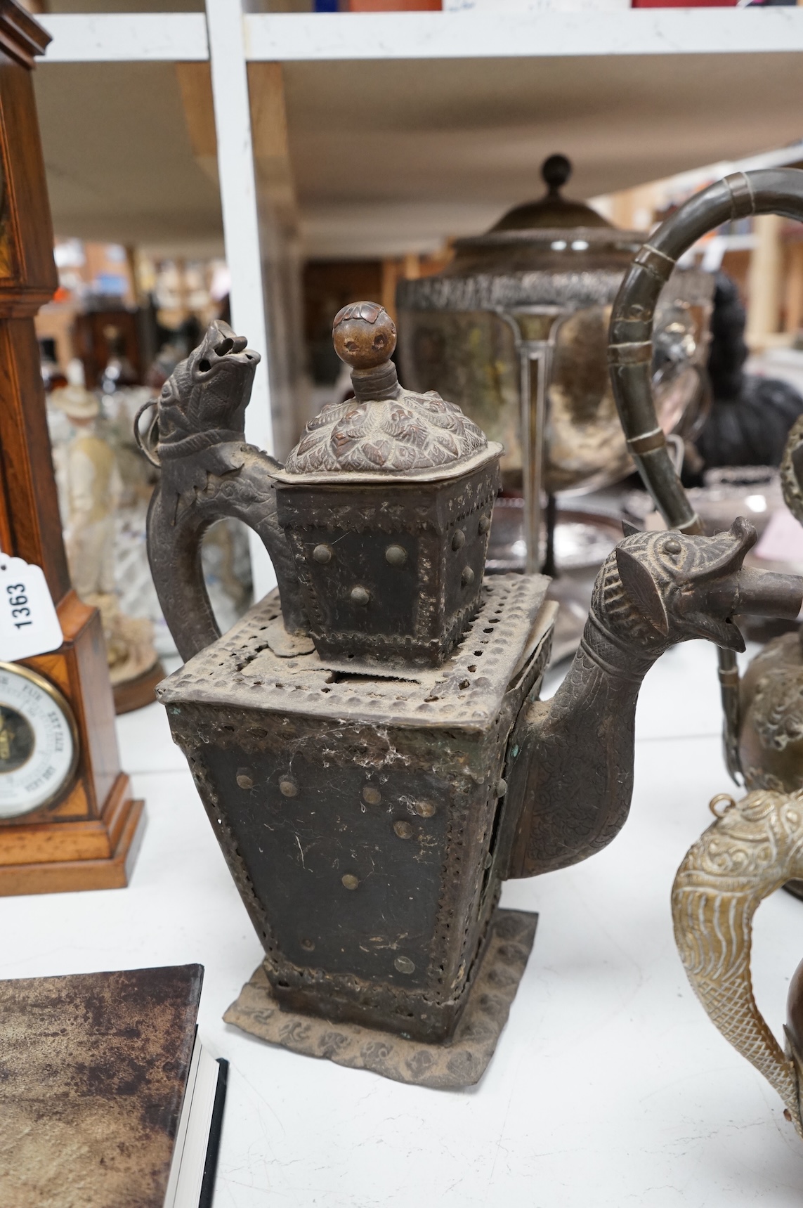 A collection of Asian embossed metalware, largest 41cm high